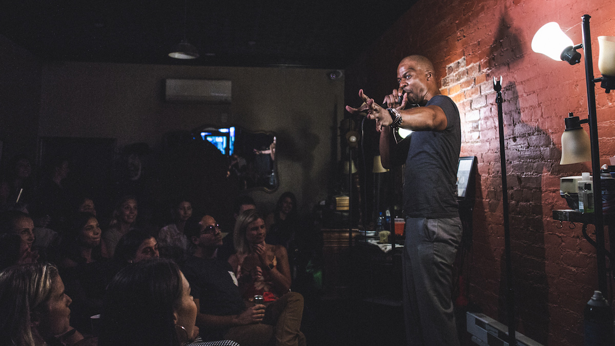 Comedian performing stand-up at Live at the Barbershop in the East Village
