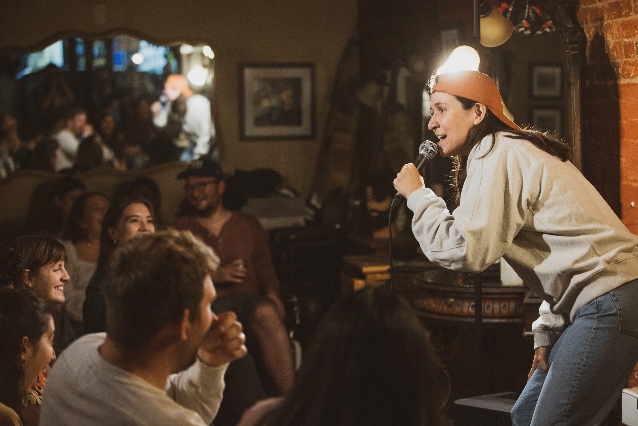 Comedian performing stand-up at Live at the Barbershop in the East Village